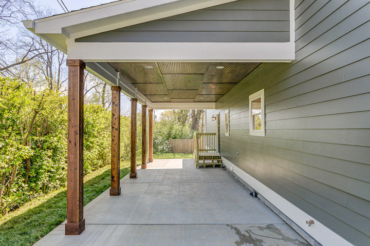 Covered Carport with cedar wrapped beams